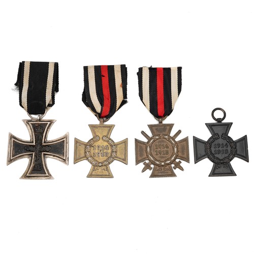 65 - A collection of WWI German medals to include an Iron Cross 2nd Class medal, an Honour Cross with swo... 