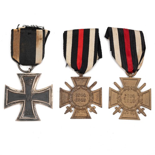 66 - A collection of WWI German medals to include an Iron Cross 2nd Class, and two Honour Cross's with sw... 