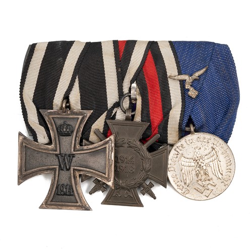 67 - A collection of WWI and WWII medals to include the Iron Cross 2nd Class, Honour Cross with swords, a... 