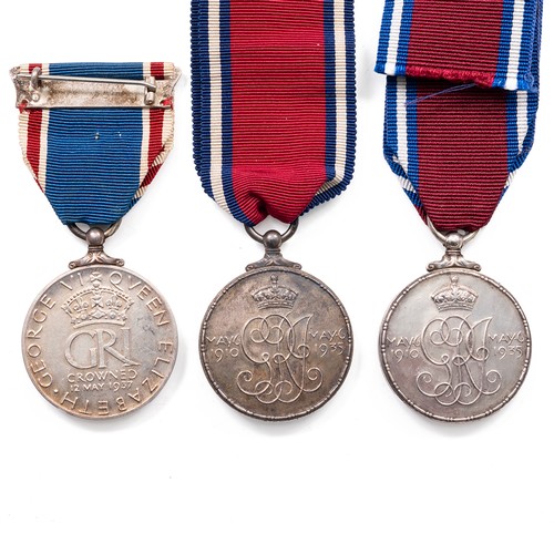 71 - A collection of medals to include a pair of King George V and Queen Mary Medals and King George VI a... 