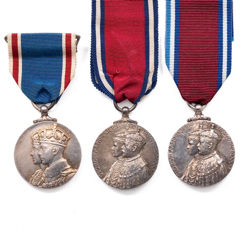 71 - A collection of medals to include a pair of King George V and Queen Mary Medals and King George VI a... 