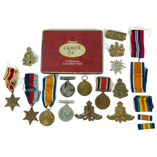 78 - A collection of cap badges and medals to include 1914-1918 War medal; a Victory medal awarded to 645... 