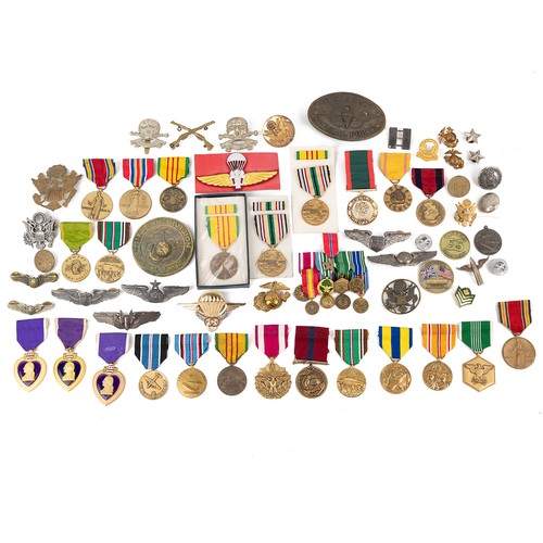 91 - A large collection of mixed United States medals and badges, to include three Purple Hearts, various... 