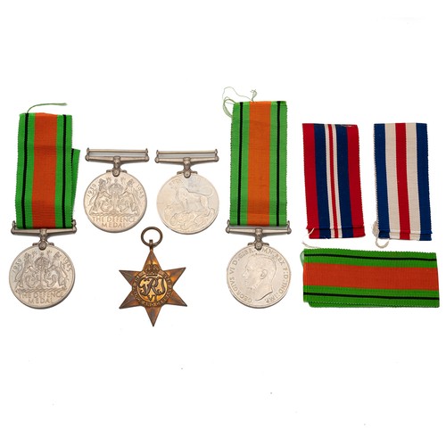 99 - A collection of WWII British service medals, to include France and Germany Star, three Defence Medal... 