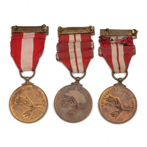 105 - A group of three 1939-1946 Irish Emergency Medals. One example with two bars, one example with one b... 