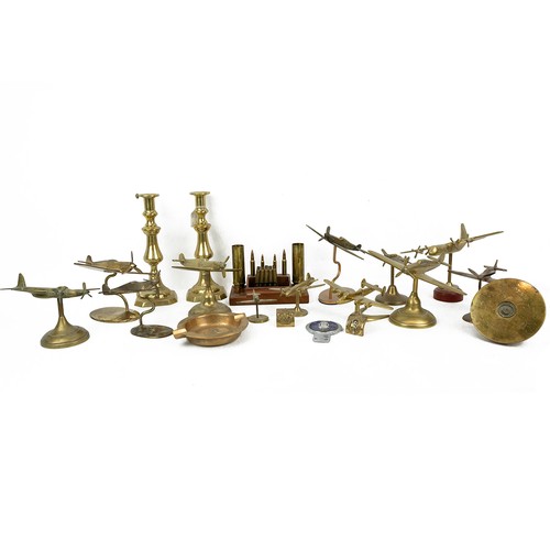 118 - A large collection of cast brass vintage military aeroplanes, including the Spitfire, and a Trench A... 
