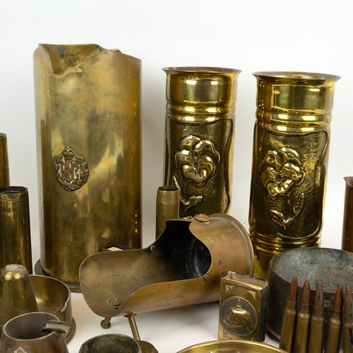 120 - A large collection of WWI Trench Art, including embossed shells, RFC jug, egg cups, ashtrays, etc.