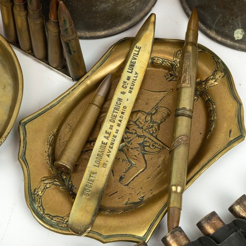 120 - A large collection of WWI Trench Art, including embossed shells, RFC jug, egg cups, ashtrays, etc.