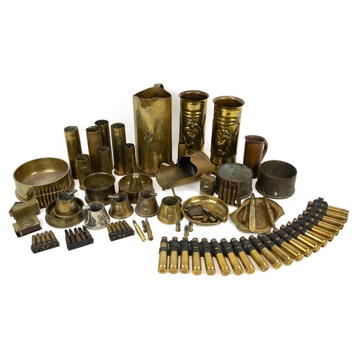 120 - A large collection of WWI Trench Art, including embossed shells, RFC jug, egg cups, ashtrays, etc.