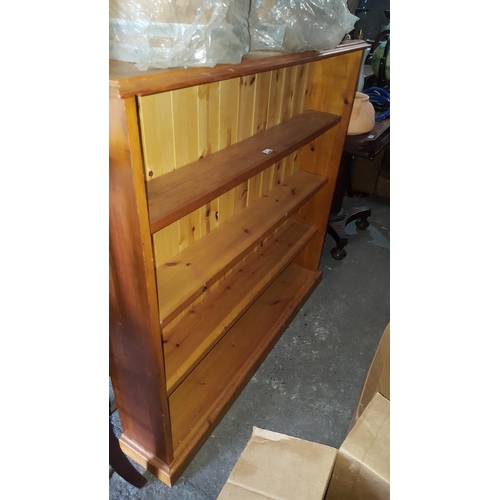 61 - A modern Pine narrow shelf Bookcase.