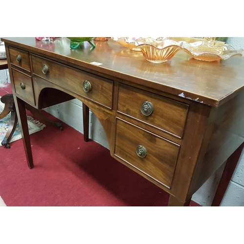 87 - A Regency Mahogany Kneehole Side Table with Boxwood inlay on tapering supports.