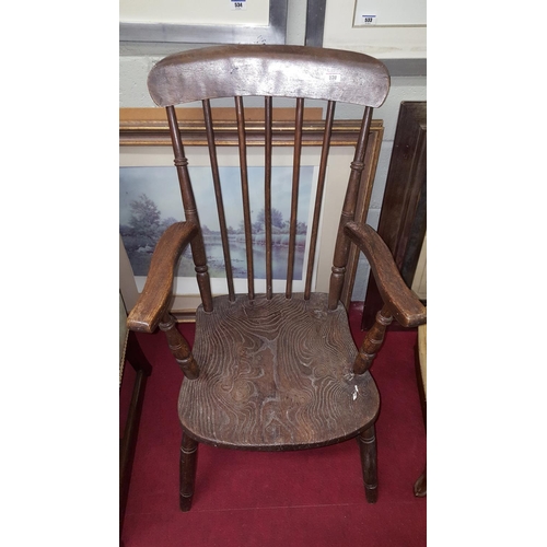 110 - A 19th Century stick back Kitchen Armchair in the Windsor style.