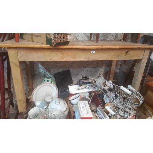 32 - A large 19th Century stripped Pine Kitchen Table with stretcher base.