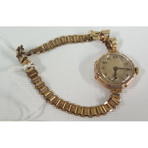 325 - A 9ct Gold Watch with no strap along with a 15ct gold headed hat pin and a 9ct Gold Ladies Cocktail ... 