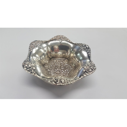 327 - A Silver salt with floral decoration and scalloped edge.