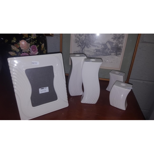 630 - A quantity of modern Belleek items to include four Candlesticks and a photo frame.Also a large decor... 