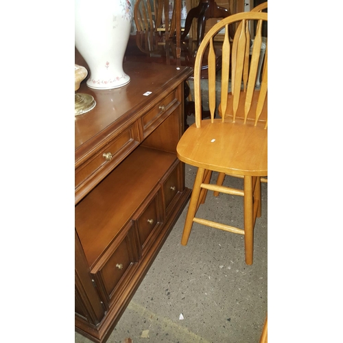 67 - A cherry wood Cabinet and four Windsor style Chairs.