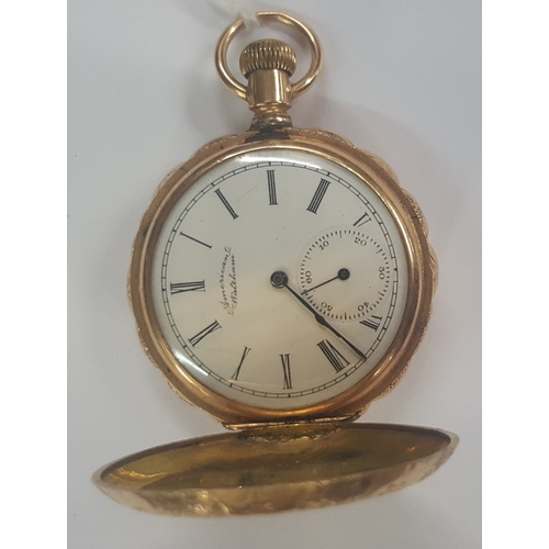 325a - A American Waltham pocket watch in a 14ct scalloped etched case.