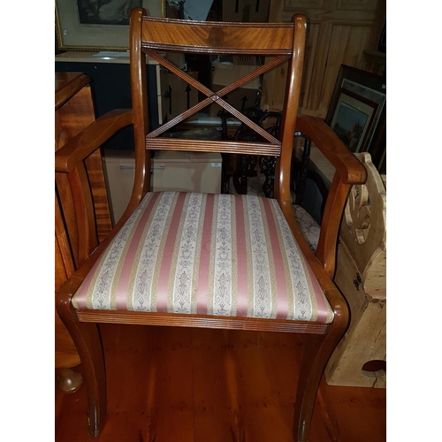 57 - A Yew wood Dining Table along with a set of chairs.