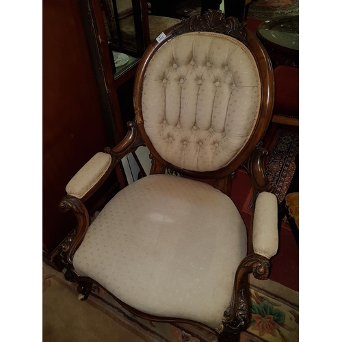 1005 - A Lovely Victorian Mahogany show frame Armchair with a highly carved outline.