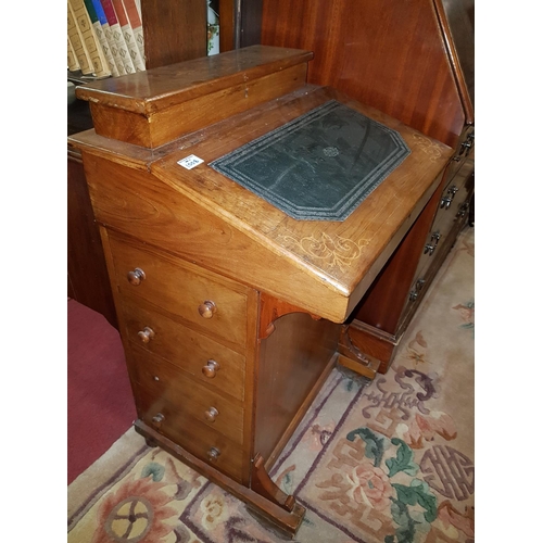 1008 - A Victorian inlaid Walnut Davenport.