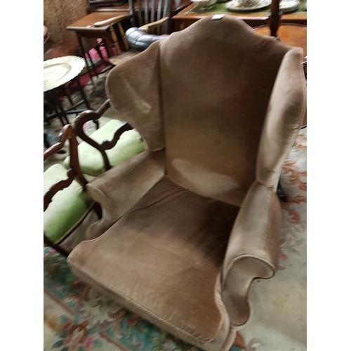 21 - A fantastic early 20th Century Camel back Wing back Armchair.