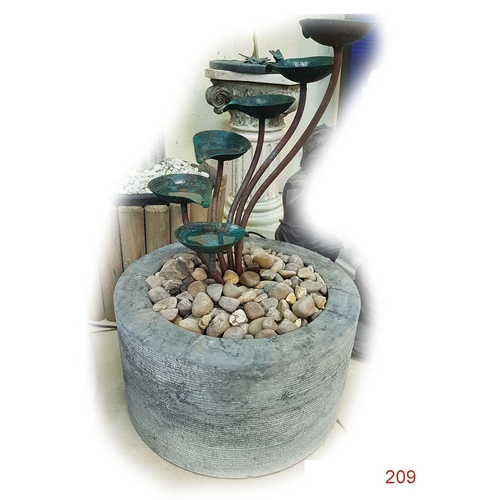 209 - A Bronze and stone floral water display.
Diameter: 40cm
Height: 62cm