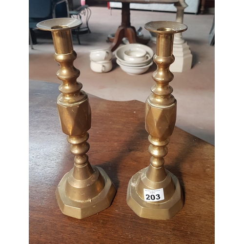 203 - A good pair of Brass Candlesticks.