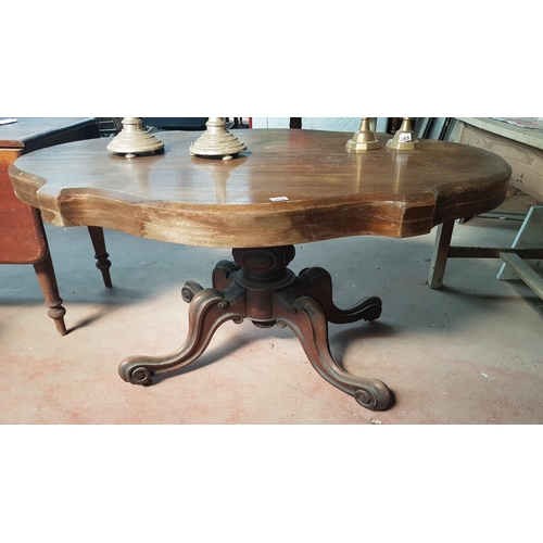 204 - A 19th Century Walnut Centre Table on a quadrafoil base.