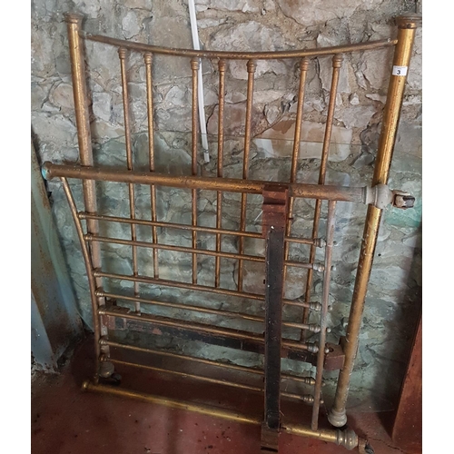 3 - A Brass Bed lacking rails.