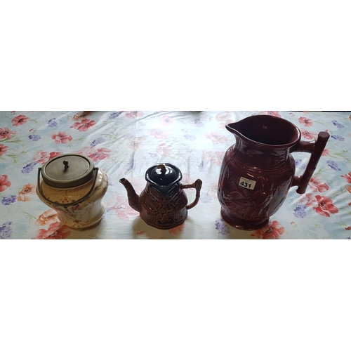 431 - A large Majolica style Jug, Teapot and Crown Devon biscuit barrel.