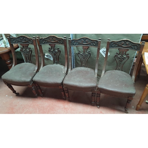 65 - A Set of four late 19th early 20th Century Walnut Chairs.