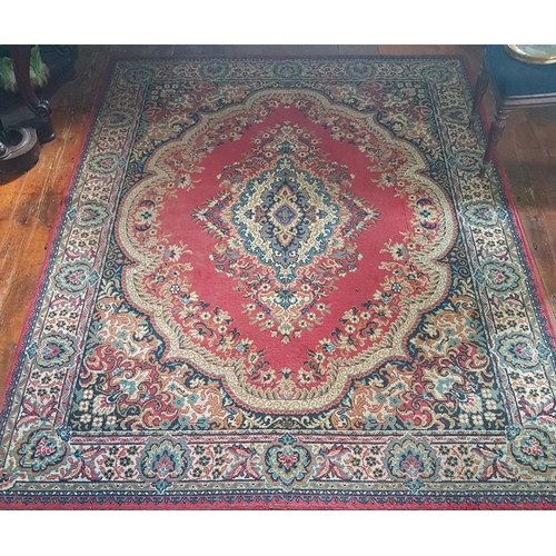 586a - A large Burgundy ground Rug with allover decoration and multi borders. 280 x 201cm.