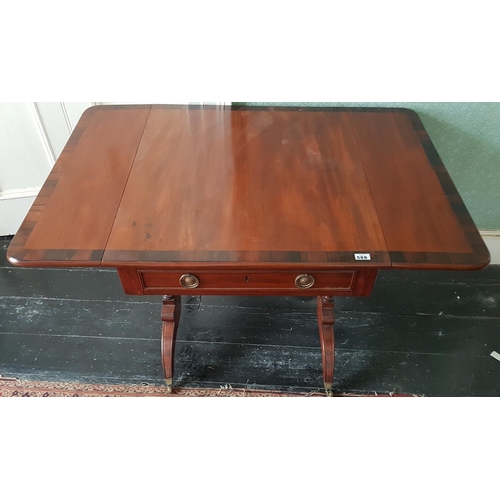 588 - A good Regency Mahogany Sofa Table with Rosewood crossbanding. L 118 x D 82cm.