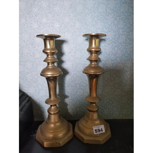 594 - A good pair of 19th Century Brass Candlesticks.