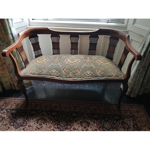 620 - An Edwardian Mahogany Inlaid two seater Showframe Couch. W 111cm.