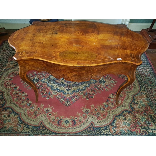 635 - A really fine mid 19th Century Walnut and Burr Walnut Inlaid Centre Table with a serpentine outline ... 