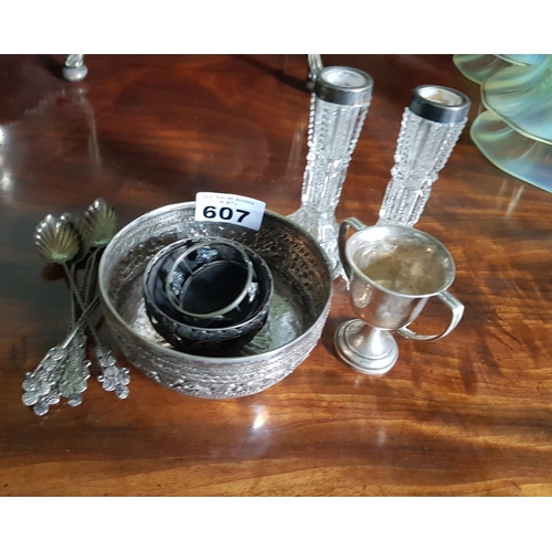 607 - A Silver Trophy Cup, a pair of Silver topped Bud Vases along with other items possibly silver.