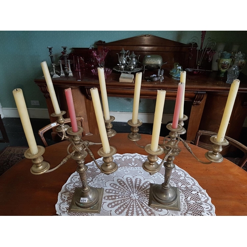 631 - A pair of early 20th Century four branch Plated Candelabra.