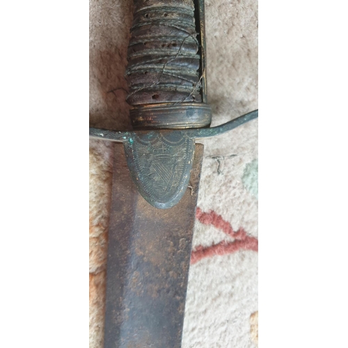 544 - A 19th probably earlier Century Irish Sword and Scabbard with what looks like an Irish crest. Dublin... 