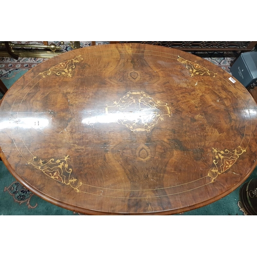 589 - A lovely 19th Century Walnut Inlaid Oval Supper Table on a quatrefoil base.