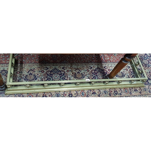 729 - A good 19th Century Brass Fender with turned finials. W 131 H 71cm.