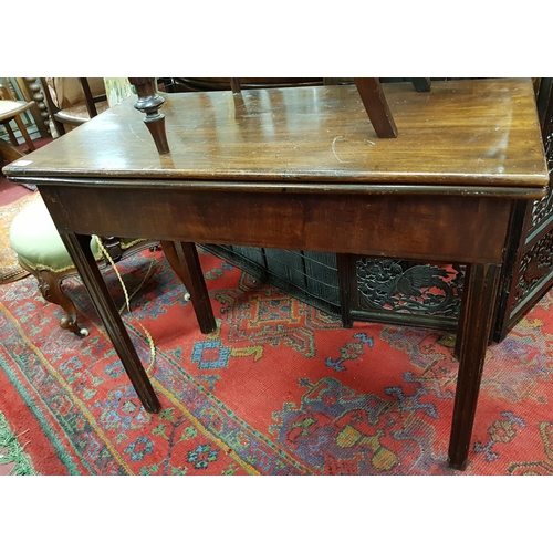 857 - A Regency Mahogany Foldover Tea Table. 90 cms w x 44 cms d x 73 cms h.