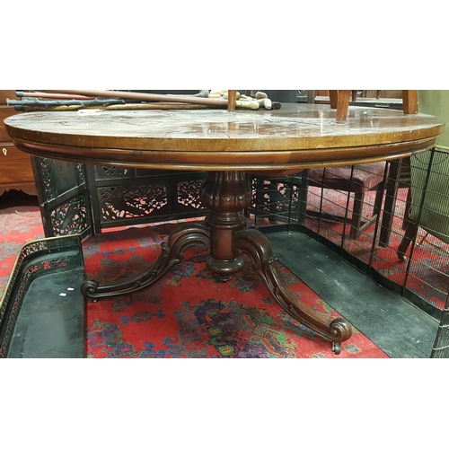 874 - A fabulous 19th Century Rosewood veneered circular Dining Table on a carved tripod base. Diam.137cm.