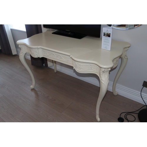 357 - A cream painted Table / Desk. 1250w x 670d x 750h.