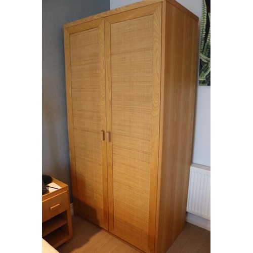 907 - A white oak Wardrobe with woven front. 1100w x 600d x 2050h.