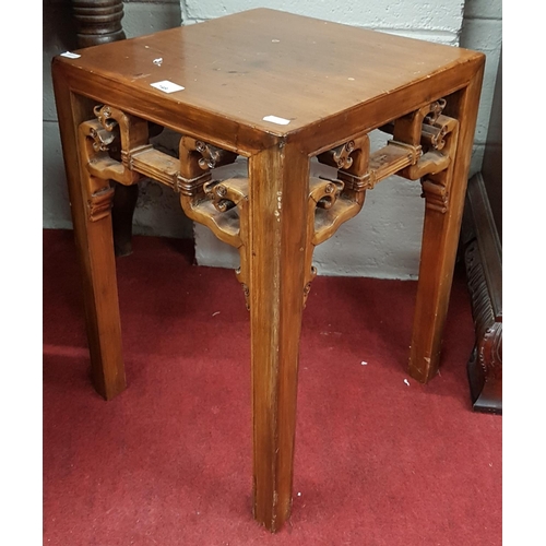 149 - An Oriental Hardwood Table.