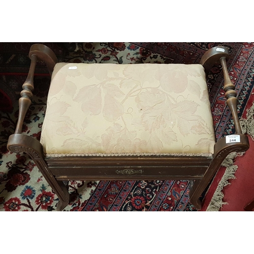 244 - An Edwardian Walnut Piano Stool.