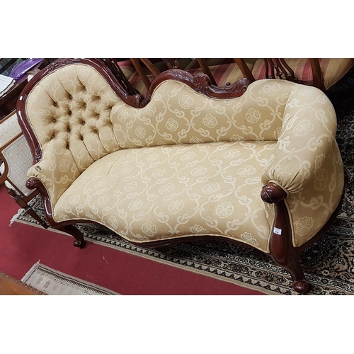 276 - A Victorian style deep buttoned Mahogany Showframe Chaise Longue.