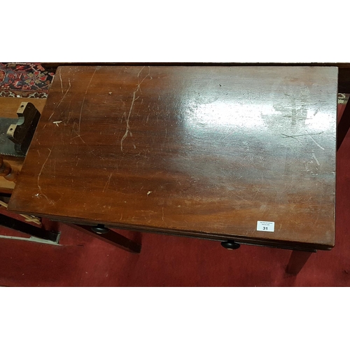 31 - A Georgian Mahogany Fold Over Tea Table with original rosewood and mother of pearl handles.